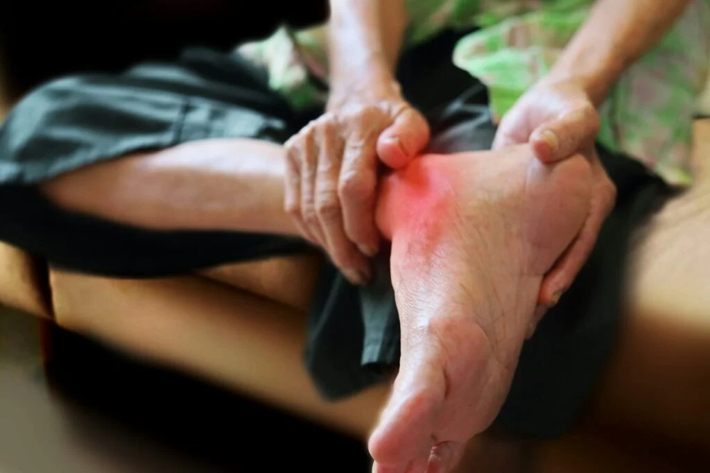 Patient in walking boot recovering with crutches